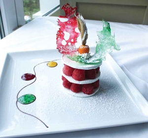Meringue Praline - served with a praline cream and fresh raspberries; topped with Frangelico liqueur marinated cranberries. at Ascots.